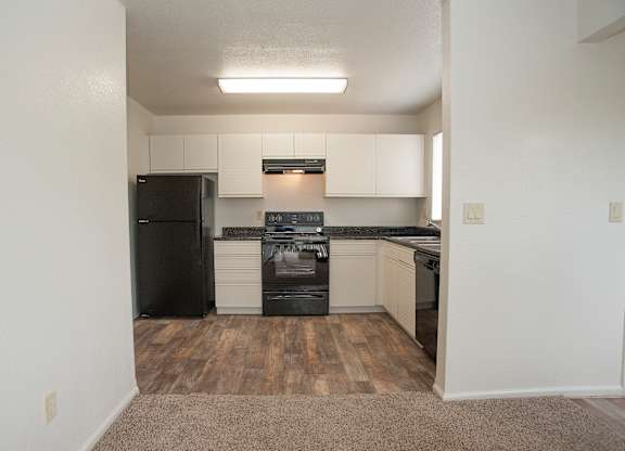 Vacant studio kitchen and dining area at Autumn Oaks Apartments, Roseville, CA