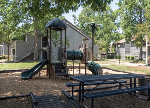 Bishops Court playground and picnic table at Bishop's Court Apartments, CA 95670