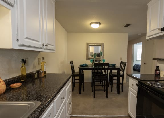 upgraded model kitchen and dining room view at Bishop's Court Apartments, California