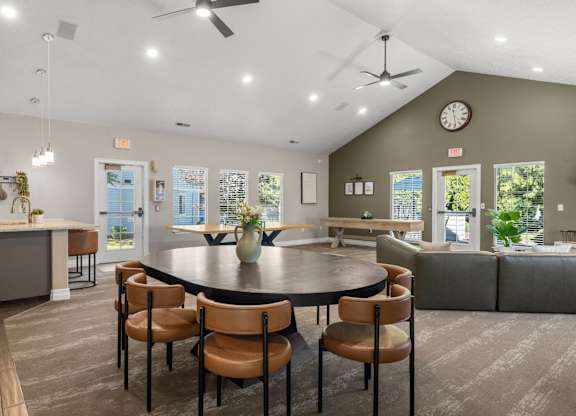 A clubhouse dining room with a round table and chairs at Clackamas Trails Apartments, Oregon, 97222