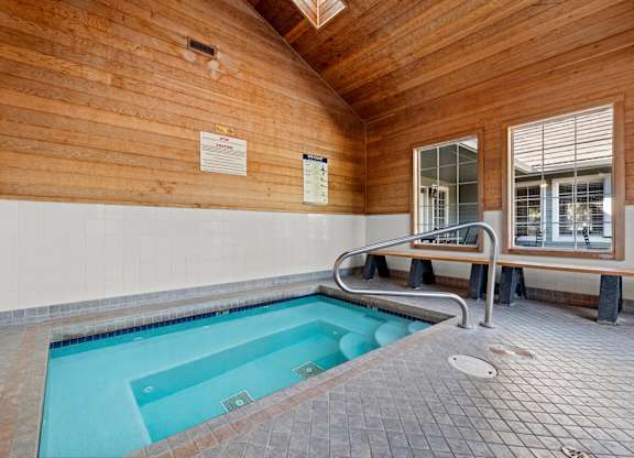 An indoor spa with a bench and a window at Clackamas Trails Apartments, Oregon, 97222