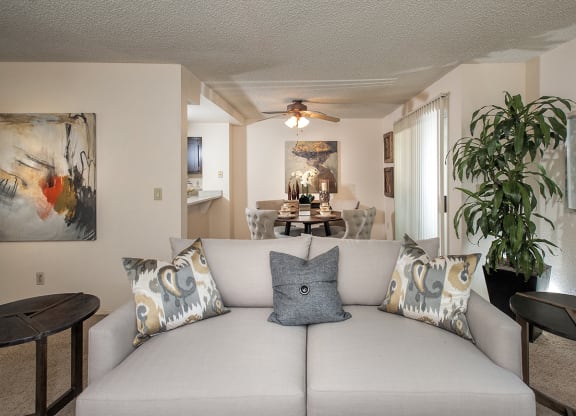 Model Living Room & Dining Room With Furniture at Delta Pointe Apartments, California