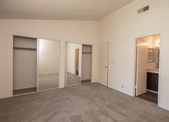 vacant primary bedroom and bathroom at Delta Pointe Apartments, California