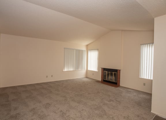 vacant living room with fireplace at Delta Pointe Apartments, Sacramento, California 95833