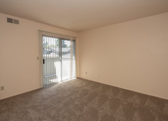 vacant primary bedroom deck at Delta Pointe Apartments, Sacramento