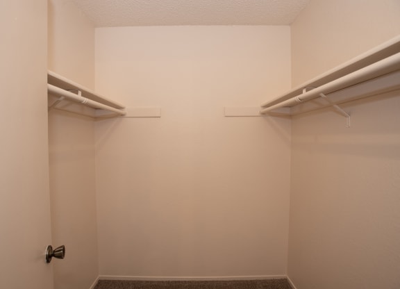 vacant primary bedroom walk in closet at Delta Pointe Apartments, Sacramento, CA