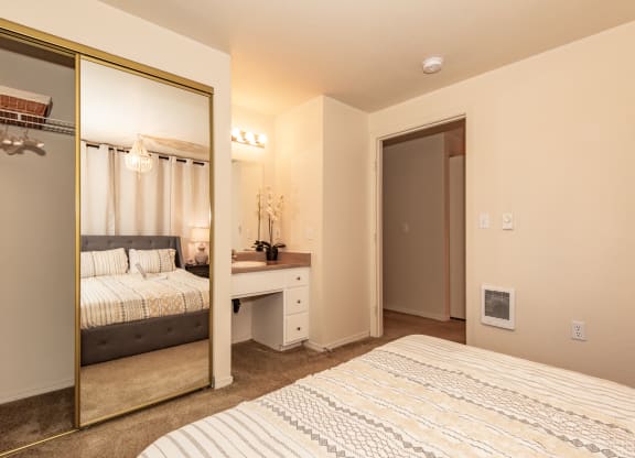 Hathaway Court model primary bedroom and vanity at Hathaway Court Apartments, Wilsonville