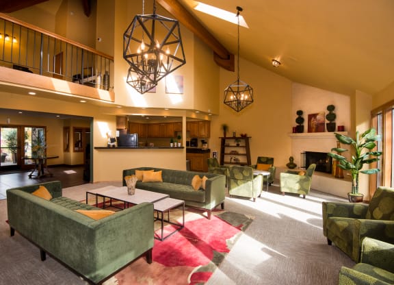 Kings Court clubhouse seating area, fireplace, and kitchen