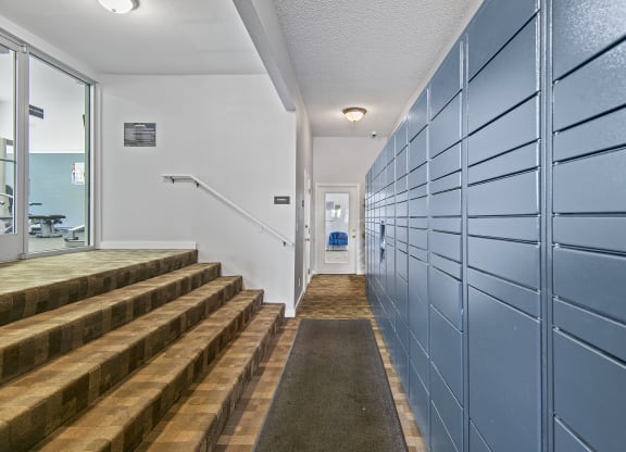 Riverwood self service package lockers and stairs to gym