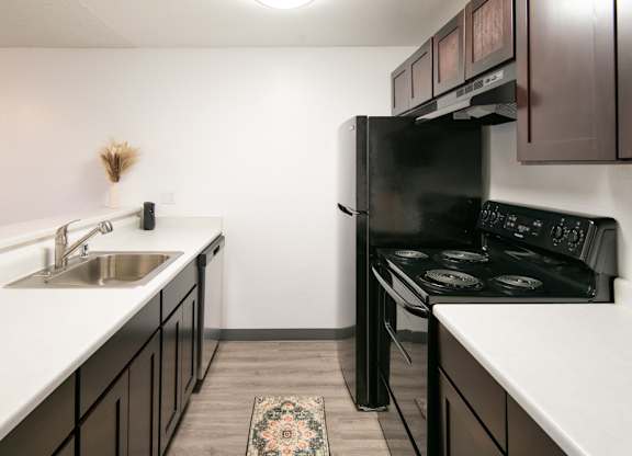 Vacant upgraded kitchen long view at Riverwood Apartments, Kent, Washington 98032
