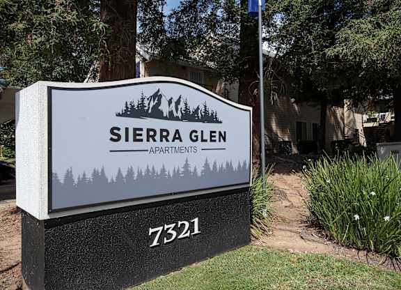 A sign for Sierra Glen Apartments is displayed in front of a building at Sierra Glen Apartments, California, 95621