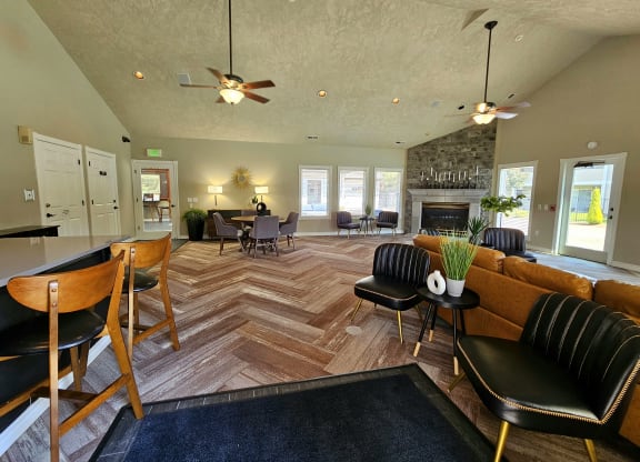clubhouse kitchen bar seating and fireplace lounge at Sir Charles Court Apartments, Beaverton