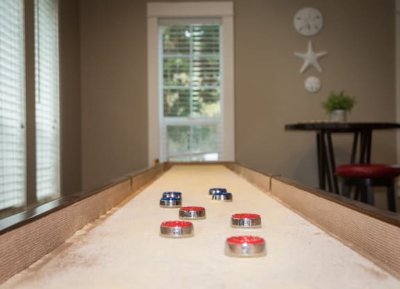 Stillwater clubhouse interior shuffleboard amenity