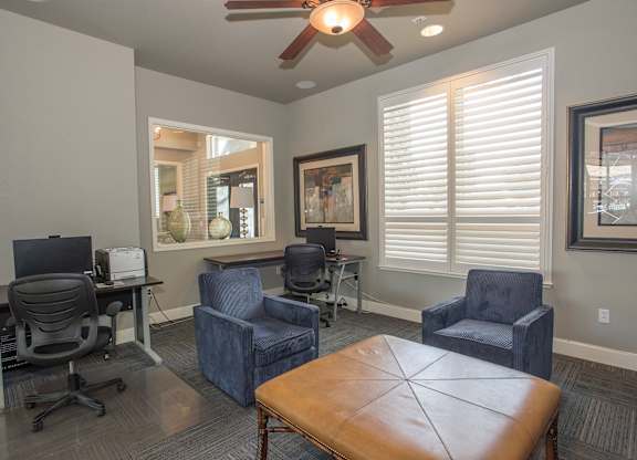 A room with a brown leather table and blue chairs at Stoneridge Apartments, California, 95661
