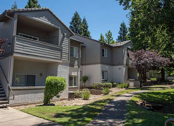 Apartment complex with a staircase leading to the entrance at Sunset Summit, Rocklin, CA, 95765