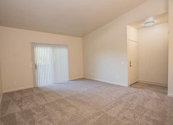 A room with a carpeted floor and a window with blinds at Sunset Summit, Rocklin, CA, 95765
