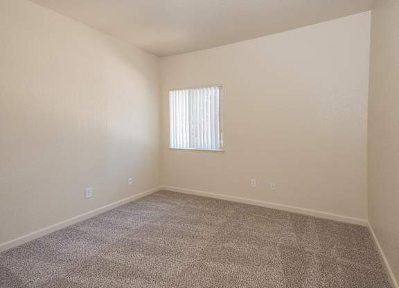 A room with a carpeted floor and a window with blinds at Sunset Summit, Rocklin, CA, 95765