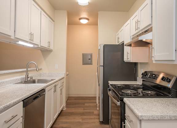 A kitchen with a black refrigerator and stove at Sunset Summit, Rocklin, CA, 95765