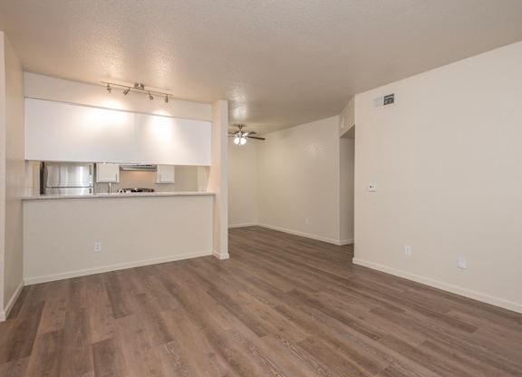 A room with wooden flooring and white walls at Sunset Summit, Rocklin, CA, 95765