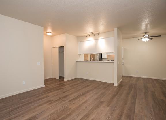 A room with wood flooring and a ceiling fan at Sunset Summit, Rocklin, CA, 95765