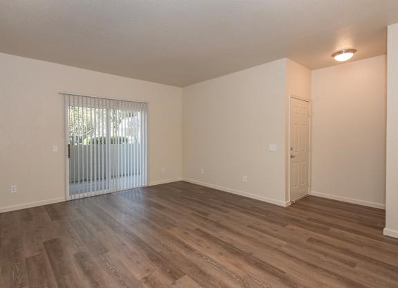 A room with wooden flooring and a window with blinds at Sunset Summit, Rocklin, CA, 95765