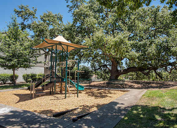 A playground with a slide at Sunset Summit, Rocklin, CA, 95765