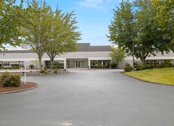 Sunset West Business Park office building exterior main entry and parking lot