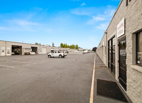Sunset West Business Park leasing office exterior entry and parking lot view