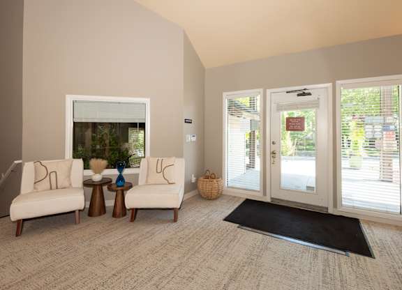 A living room with a sofa, a table, and a window at Sunstone Parc, Beaverton, OR, 97008