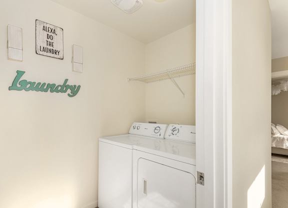 A laundry room with a washer and dryer at The Landing Apartments and Townhomes, Oregon, 97045