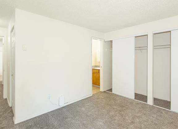 A room with white walls and a carpeted floor at Todd Village Apartments, Oregon, 97062