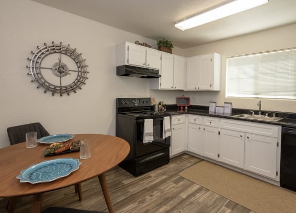 model kitchen and dining room at Woodbridge Apartments, California