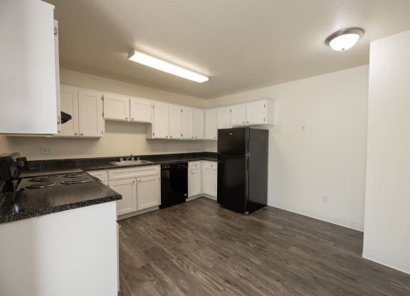 vacant 2x2 kitchen side view at Woodbridge Apartments, California