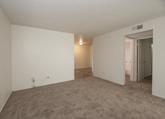 vacant 2x2 living room and hallway at Woodbridge Apartments, CA 95833