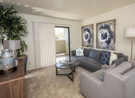 Model Living Room & Patio Sliding Door at Zinfandel Village Apartments, CA 95670