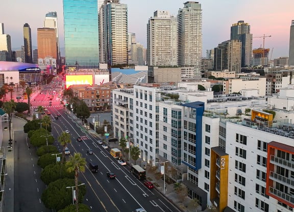 an aerial view of the city at sunset