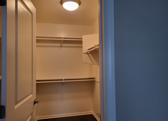 Large walk-in closet in master bedroom at The Cove at Bear Valley in Escondido, California.