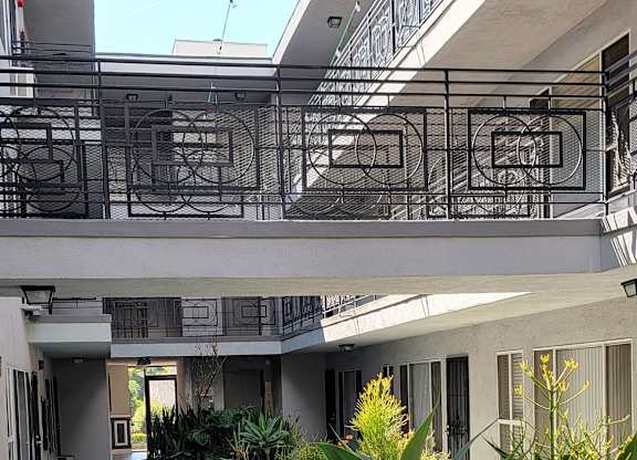 A modern building with a glass ceiling and a concrete floor.