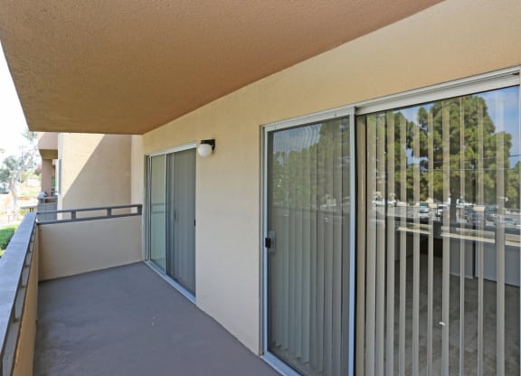 Private balcony with access from master bedroom and livingroom at Villa Pacific Apartments in Oceanside, California.