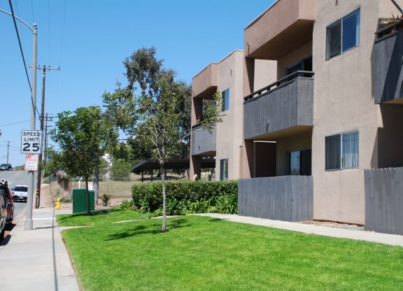 Lawns and gardens in front of Villa Pacific Apartments in Oceanside, California.