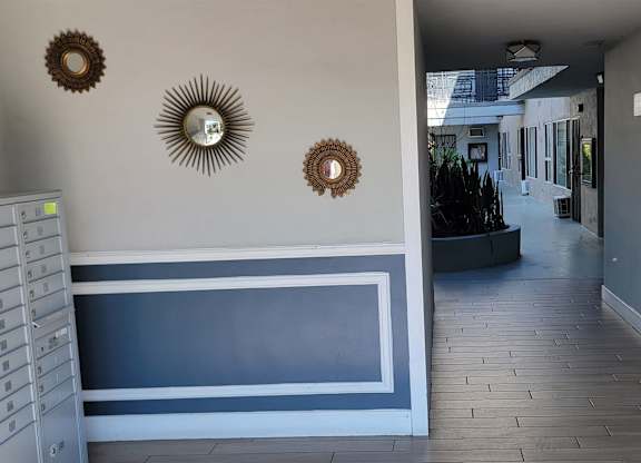 Front entry at The Carlton with mailboxs and courtyard in Hollywood, California.
