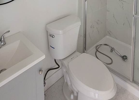 Second bathroom with shower in 2-bedroom apartment at the Hardison Apartments in Pasadena, California.