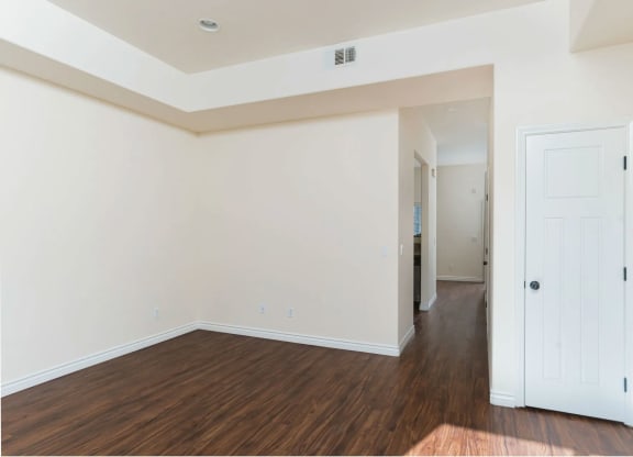 Wood style laminate flooring and high ceilings at The Nines Townhomes in Escondido, California.