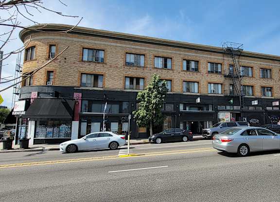 Mid-day street view of the Western at Rosewood apartments in Los Angeles, California.