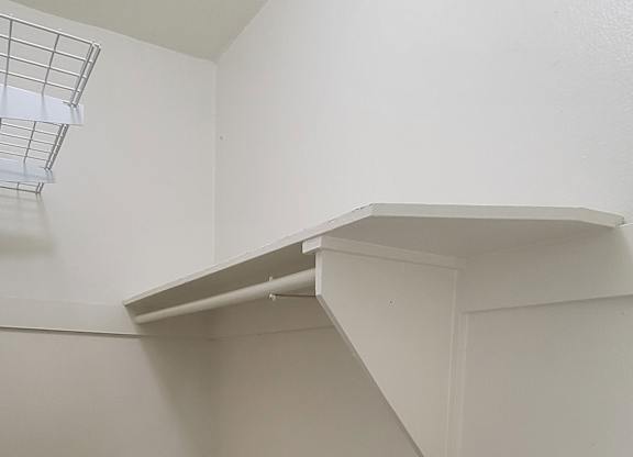 Shelves and built in chest in large closet at the Western At Rosewood apartments in Los Angeles, California.