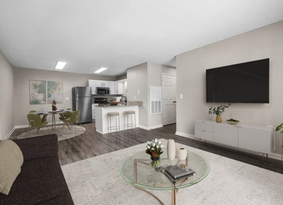 addison point interior staged model an open living room and kitchen with a large screen tv