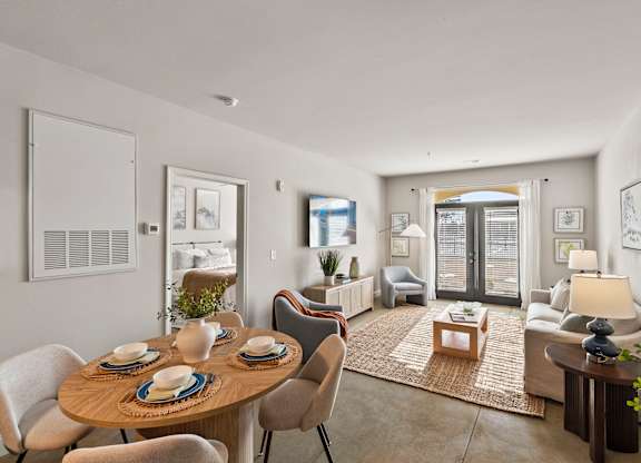 A dining table with chairs around it in a room.
