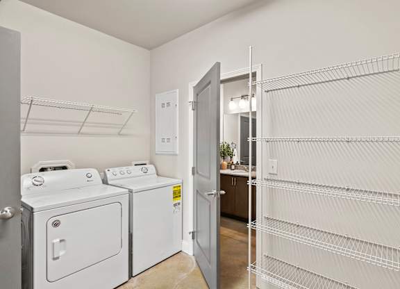 A laundry room with a washer and dryer.