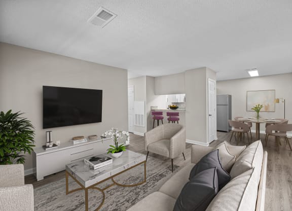 addison point interior staged model a living room with a couch and a table and a television