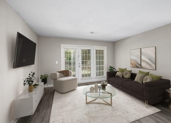 addison point interior staged model  living room with a couch and a tv